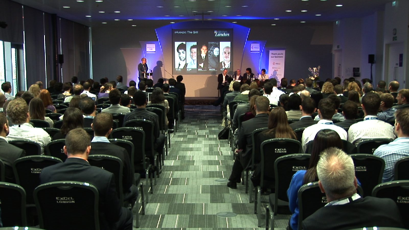 Conference audience during a panel discussion